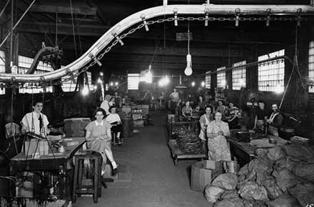 Group portrait of mostly female workers at Clark Cable Corporation