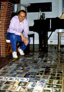 Walter Leedy at home with his postcards