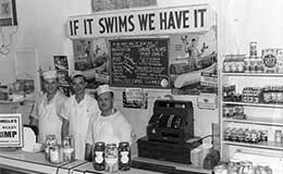 Euclid Fish Company counter with sign that says If It Swims We Have It.