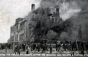 Fighting the fire at its height. After the building had become a funeral pyre.