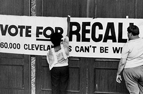 Supporters of the effort to recall Dennis Kucinich hang a sign Aug. 13, 1978.