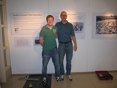 Dr. Walter Leedy with postcards spread out on floor