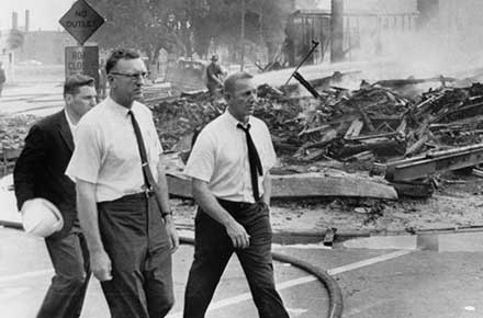 Mayor Ralph Locher walks through the Hough neighborhood after the first day of rioting